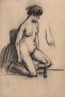 Model posed kneeling with her left...